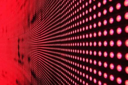 Close-up of a red LED display creating a perspective dot pattern.