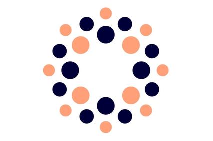 A circular pattern formed by blue and salmon-colored dots on a white background.