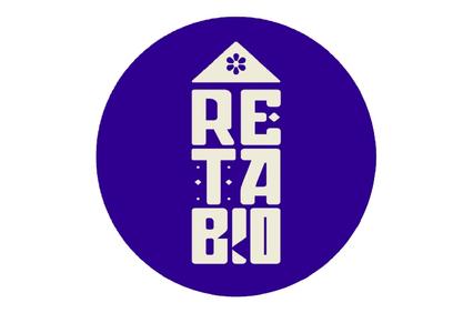 A purple circular logo with the text 'RE TA BIO' under a symbol of a house and a flower.