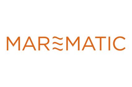 The image displays the word 'MAREMATIC' in orange font with a stylized wave design above the letter 'E'.