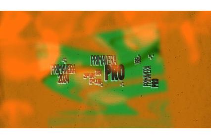Graffiti style background with the text 'Primavera Pro' in a repetitive pattern overlay.