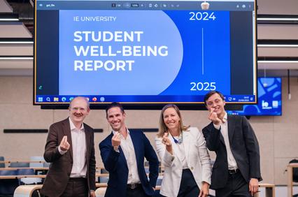 A group of professionals is presenting the Student Well-Being Report at IE University.