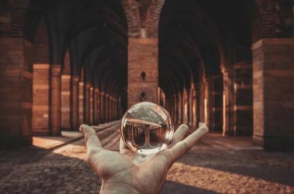 Hand holding a crystal ball