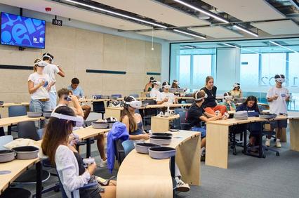 A classroom setting with students engaged in a virtual reality learning experience.