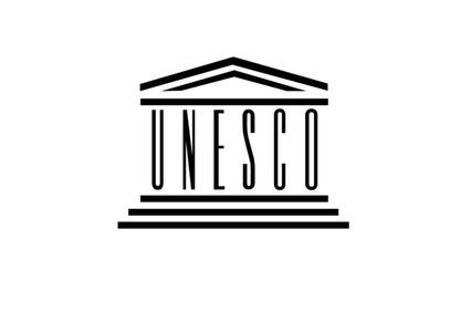 This image features the logo of UNESCO, showcasing its iconic architectural design.