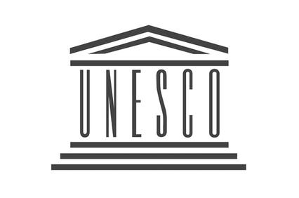 The logo of UNESCO featuring a stylized representation of a building.