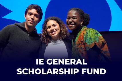 Three individuals posing for a photo at an event for the IE General Scholarship Fund.