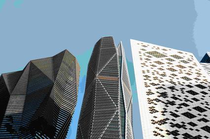 A view of modern skyscrapers with unique architectural designs against a clear sky.