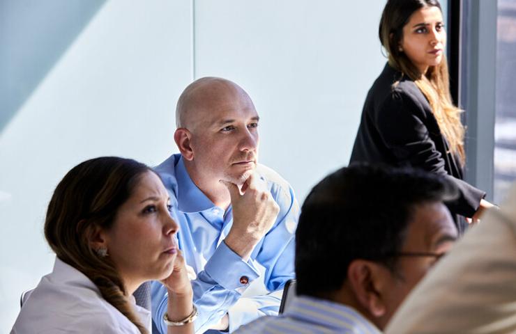 Global Executive MBA student paying attention during a class