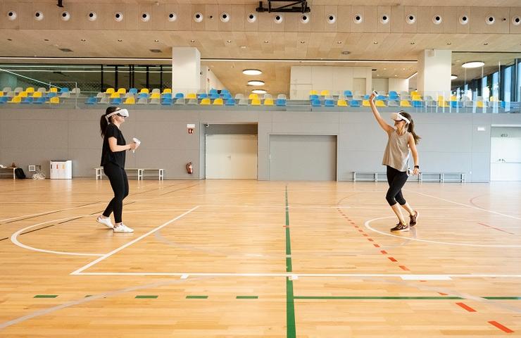 Two girls practising sport with virtual glasses