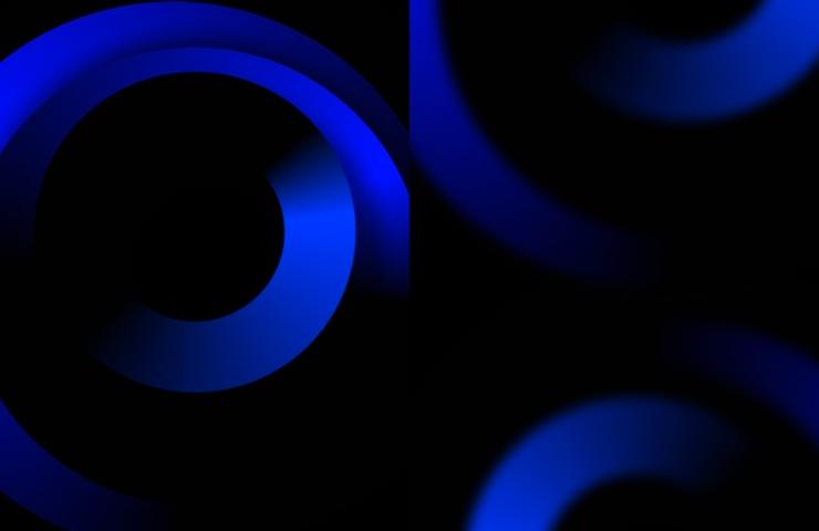 An abstract design featuring blue circular shapes against a dark background.