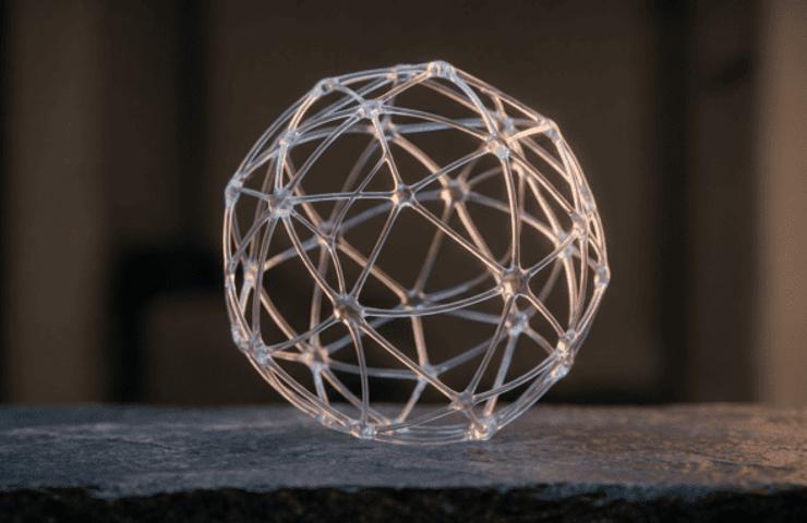 A translucent spherical structure made of interconnected lines and nodes.