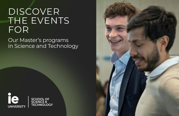 Two young men are smiling and engaging in conversation at an event promoting Master's programs.