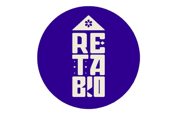 A purple circular logo with the text 'RE TA BIO' under a symbol of a house and a flower.