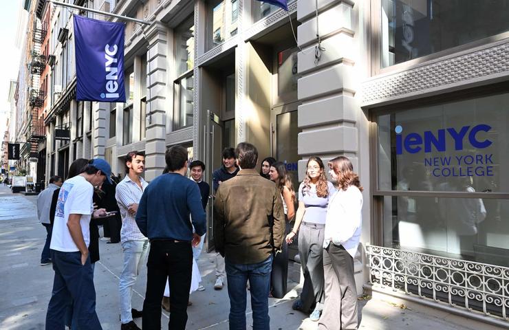 A group of students gathered outside a college building in New York City.