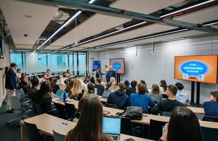 A classroom filled with students engaging in a presentation.