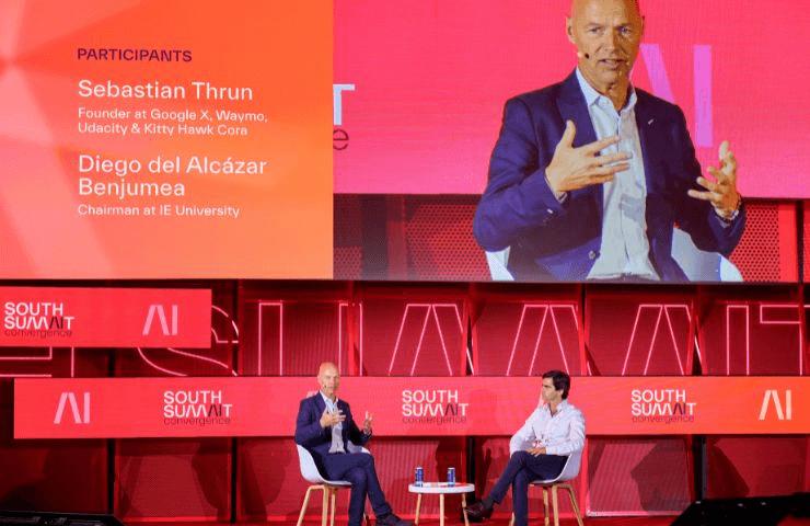 A panel discussion featuring two speakers at a conference.
