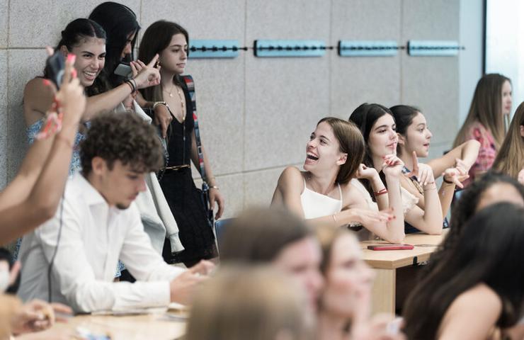 A lively gathering of young people enjoying each other's company.