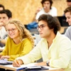 A group of students attentively engaged in a classroom setting.