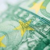 Close-up view of a Euro banknote focusing on the stars.
