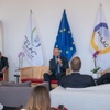 A conference setting with officials discussing EU-LAC relations.