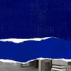 A creative composition featuring a torn blue background with a street view partially visible beneath.