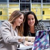 Laidlaw - two woman speaking looking a laptop