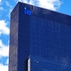 A modern skyscraper featuring the letters 'IE' prominently displayed at the top.
