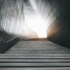 A staircase leading towards a bright light at the top.