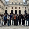 A group of people gathered in a courtyard of a historic building.
