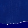 A textured blue background with a torn edge at the bottom.