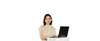 A woman smiling while working on a laptop.