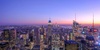 A stunning aerial view of a vibrant city skyline at sunset.