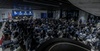 A large audience gathered for an event in a modern venue.