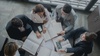 A group of professionals reviewing documents around a table.