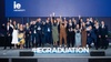 A cheerful group of graduates celebrating their achievement at an event.
