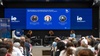 A panel discussion featuring three speakers at IE University focused on neuroscience and humanities.