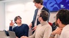 A group of students engaged in a discussion during a classroom session.