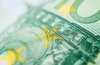 Close-up view of a Euro banknote focusing on the stars.