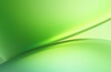 A smooth, abstract design featuring shades of green blending together.