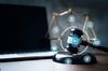 A digital gavel surrounded by technology icons representing artificial intelligence in a legal context.
