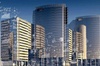 A digital artwork of a futuristic cityscape overlaid with various technological and scientific diagrams.