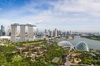 A panoramic view of Singapore showcasing modern skyscrapers and unique architectural designs.