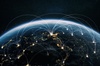 A global network of connections depicted from a satellite view of Earth at night.