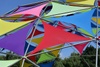 Colorful geometric canopy constructed with multicolored triangular fabrics and a metal frame