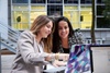Laidlaw - two woman speaking looking a laptop
