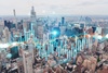 A city skyline with a digital financial graph overlay.