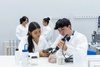 Two students are conducting an experiment in a laboratory.