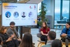 A panel discussion featuring four individuals at an event focused on personal development.