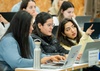 A group of students engaged in a collaborative discussion during a class.